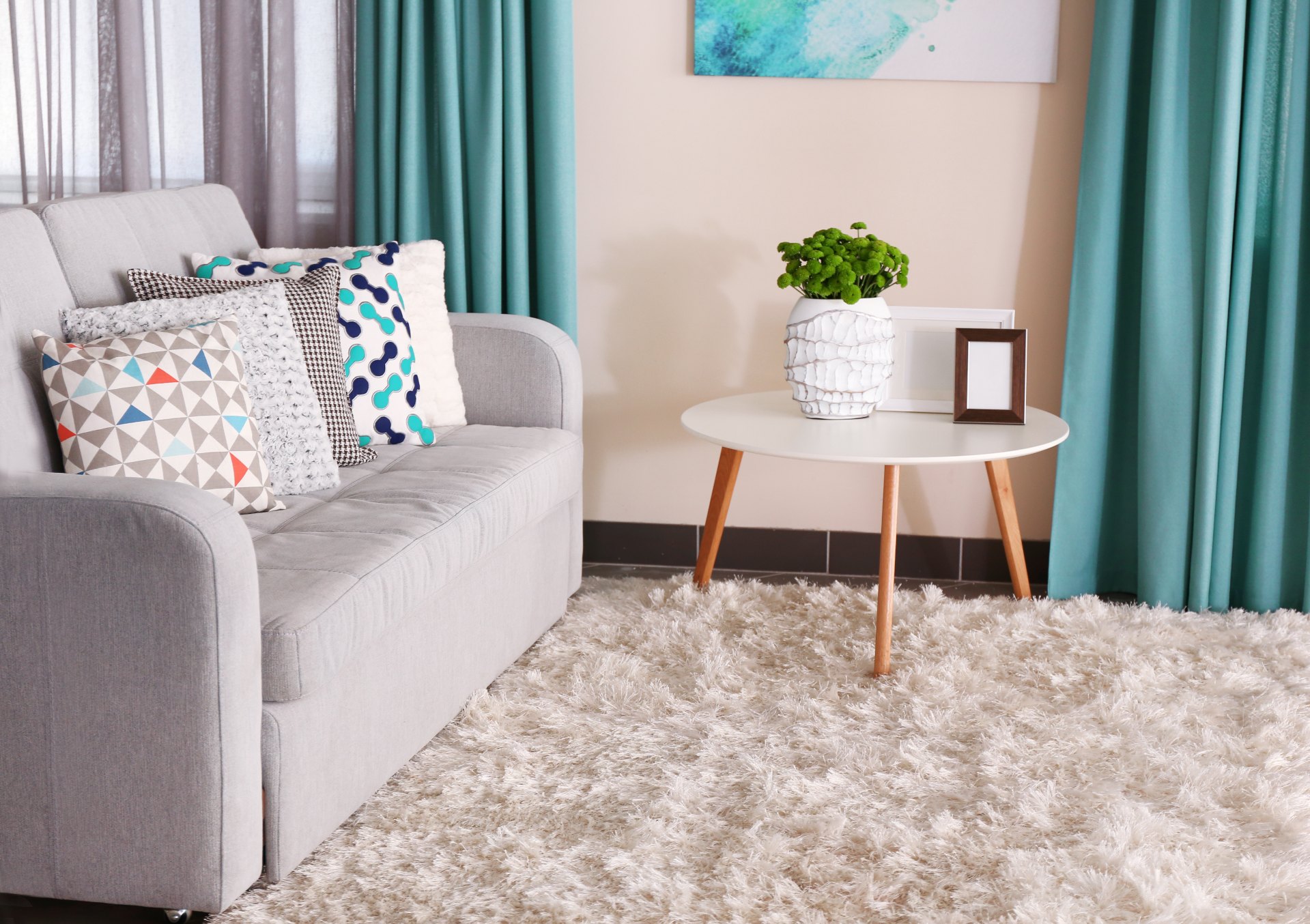 furchished living room with a large grey couch